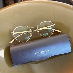 Oliver Peoples Gold Metal Round Glasses with Clear Temples